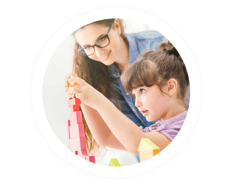 Young mother and cute girl playing together