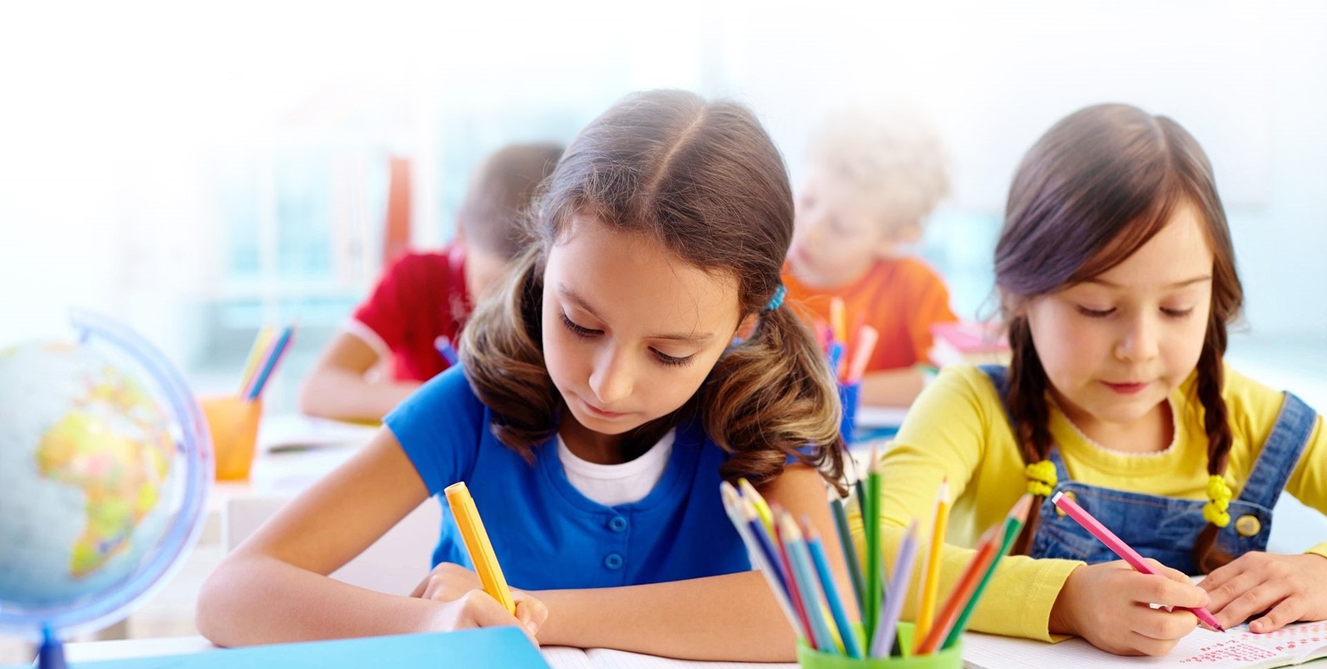Concentrated school children being occupied with a task